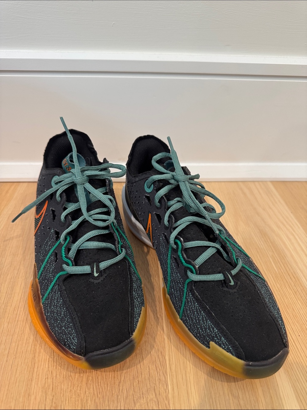 Nike Kids Black Sneakers with Teal Laces and Orange Accents